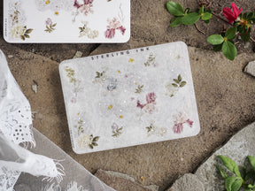 Delicate sticker sheet featuring muted watercolor floral clusters of pink, cream, and sage green blossoms for vintage journaling accents.