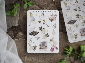 Delicate sticker sheet featuring botanical and floral icons, including teapots, leaves, and flowers, highlighted with silver foil accents.
