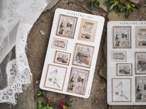 Muted picture frame stickers designed for journaling, featuring assorted vintage borders and delicate botanical artwork scenes.