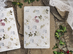 Pale floral sticker strips featuring a vintage, scattered pattern of muted blush, soft blue, and sage green wildflowers perfect for journaling.