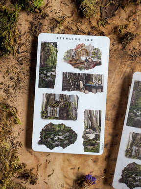 Rustic sticker sheet featuring intricate cottagecore designs of moss-covered homes and overgrown woodland scenes, perfect for scrapbooking or journaling.