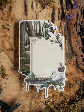 Decorative vertical frame sticker designed for journaling, featuring a tranquil scene with a white swan, lush green foliage, and rustic woodland botanical borders.
