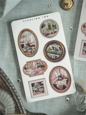 Decorative sticker sheet from STERLING INK featuring an array of ornate, vintage picture frames displaying classical interior scenes of elegant rooms.