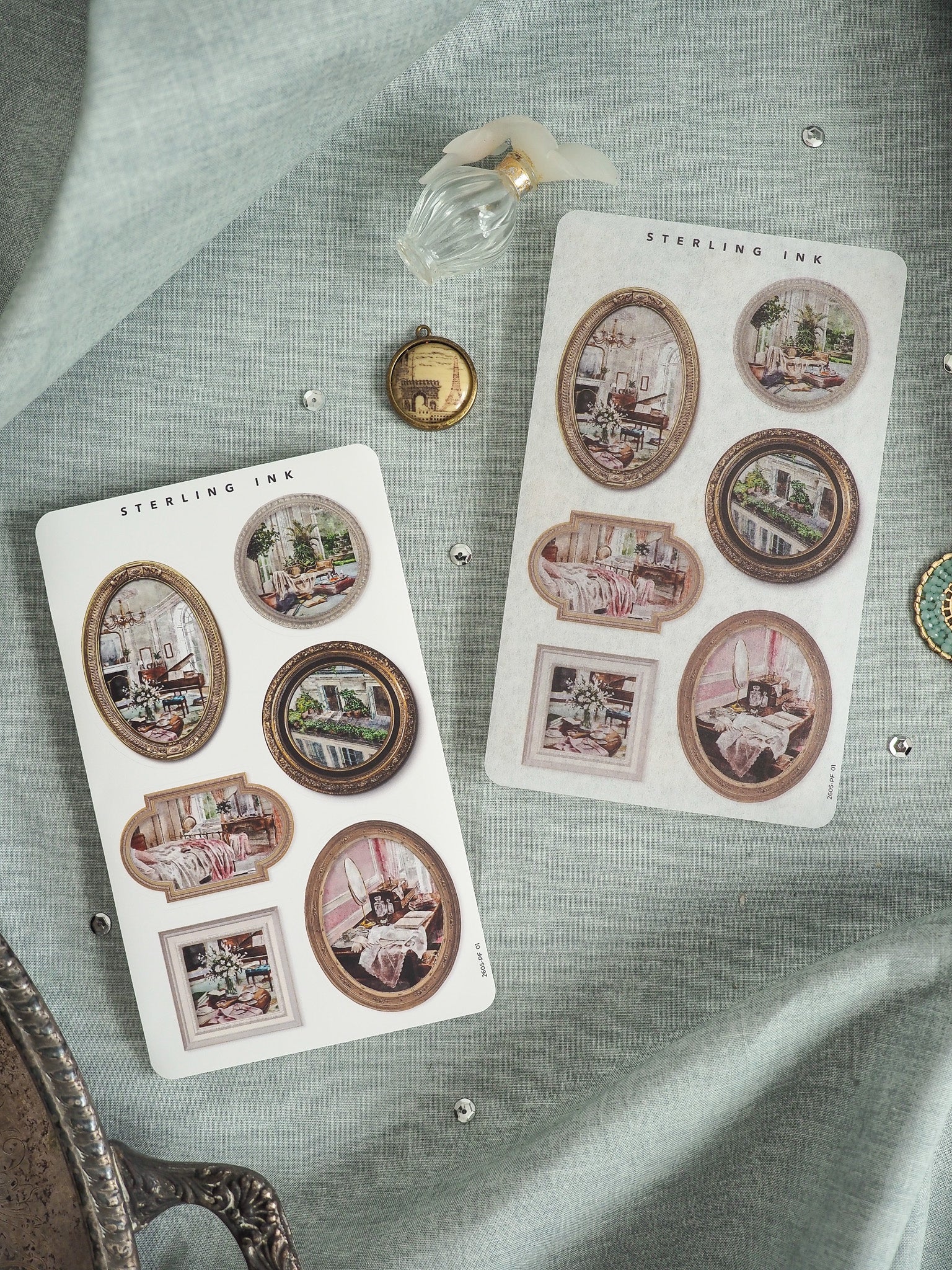 Set of "Sterling Ink" stickers featuring vintage sepia-toned engravings and illustrations of rustic indoor scenes, presented on two decorative card sheets.