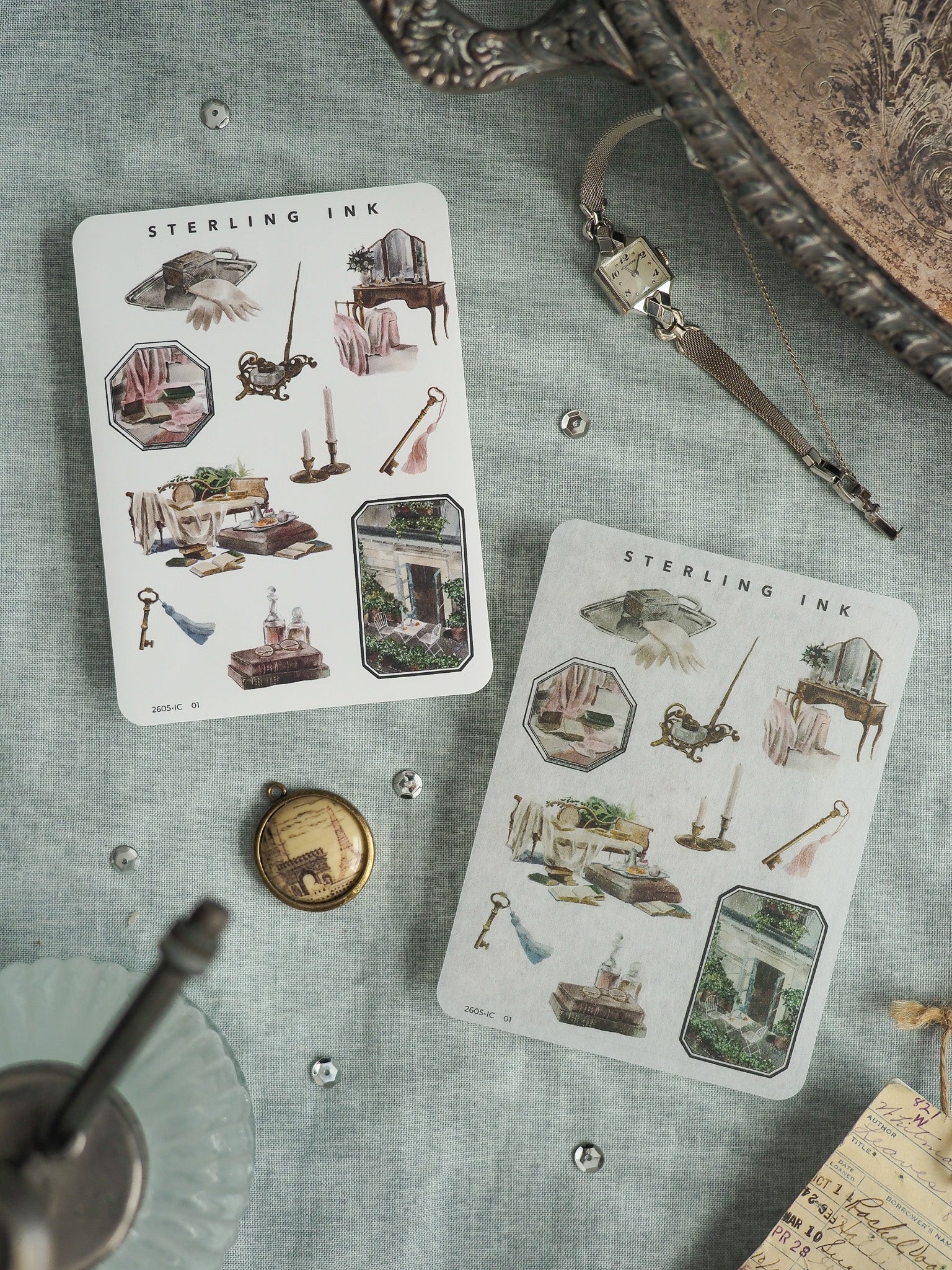 Vintage "Sterling Ink" art prints featuring detailed watercolor illustrations of rustic objects, miniature furniture, and historical motifs on aged off-white paper.