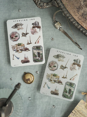 Vintage "Sterling Ink" art prints featuring detailed watercolor illustrations of rustic objects, miniature furniture, and historical motifs on aged off-white paper.