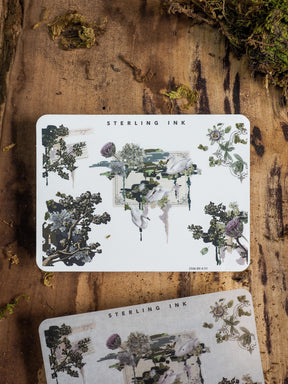 Artistic sheets of sophisticated botanical stickers, featuring dark, detailed silhouettes of floral clusters and leafy branches ideal for journaling or scrapbooking.