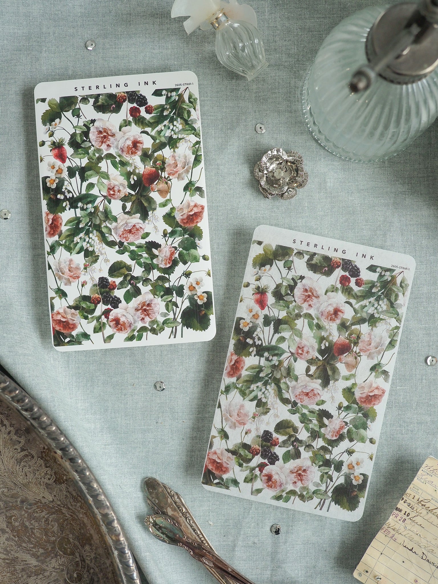 Floral botanical prints featuring a dense, romantic pattern of blush pink roses, lush greenery, and dark berries, ideal for scrapbooking or journaling.