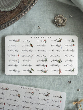 Elegant "Sterling Ink" journal sticker sheet featuring botanical designs and placeholder text, adorned with delicate watercolor illustrations of pink, green, and natural foliage.