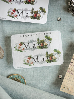 Sticker set featuring "June" and lush botanical wreaths with blush and green florals, perfect for spring crafting and scrapbooking decorations.