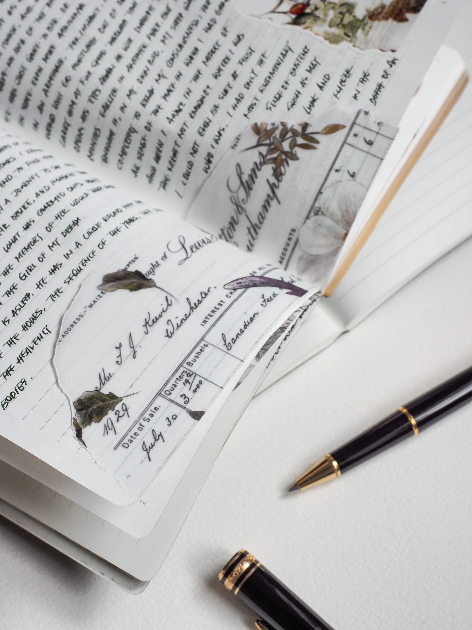 Open pages of a lined A5 notebook featuring structured, vintage-themed journaling sections, perfect for detailed planning and correspondence.