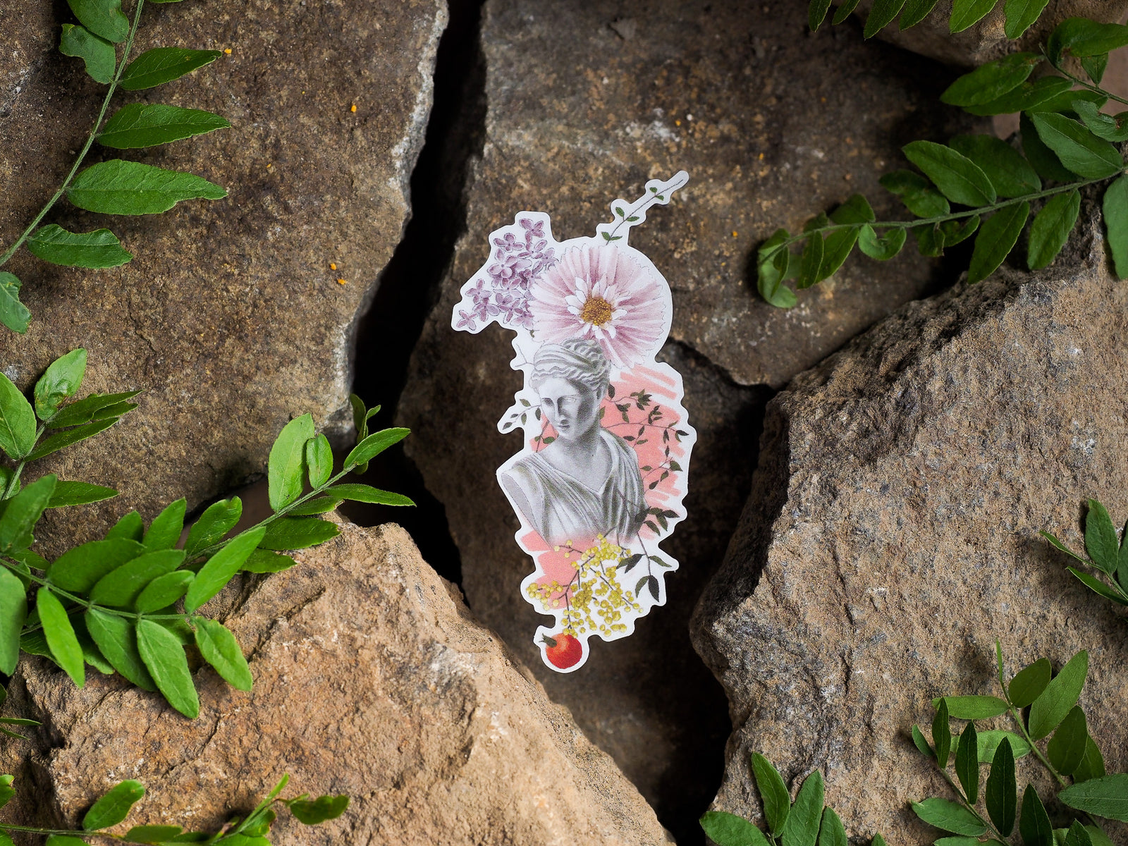 Delicate clear vinyl die-cut sticker featuring a classical bust portrait surrounded by soft watercolor pink and white floral elements.