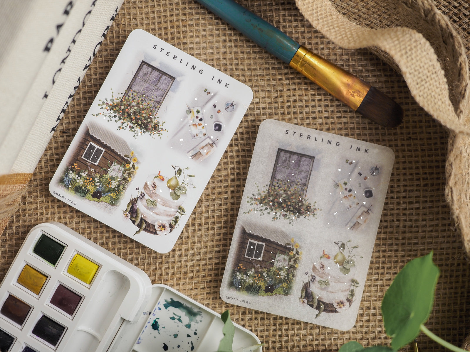 Silver foil illustration sticker sheets featuring vintage architectural vignettes of quaint houses surrounded by delicate botanical and floral patterns.
