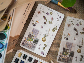 Botanical sticker sheet featuring delicate floral arrangements, realistic drawn plants, berries, and a charming rustic house illustration for July 2023 scrapbooking and journaling.