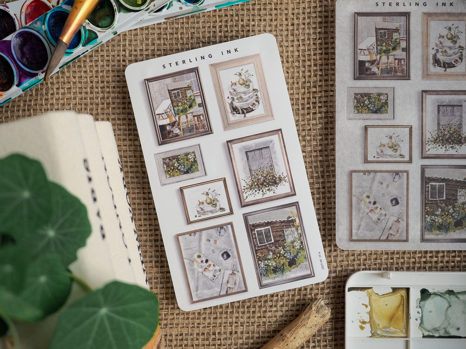 Decorative sticker sheet featuring vintage picture frames with cozy, rustic scenes, depicting florals, windows, and charming cottage vignettes.