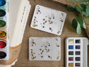 Botanical sticker sheets featuring delicate drawings of tiny flowers, berries, and leaves, perfect for journaling and craft embellishment.