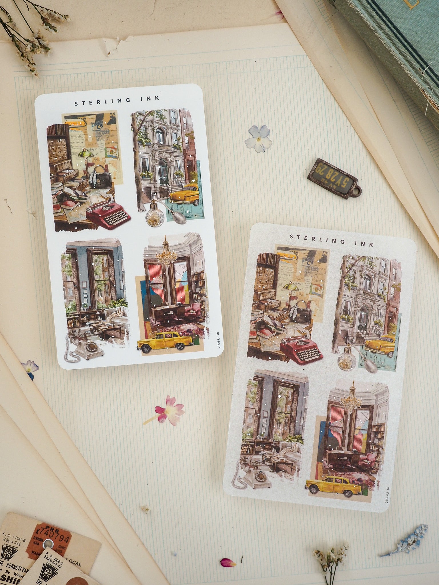 Two vintage-style sticker prints from STERLING INK showing detailed collage illustrations of European streets, yellow cabs, and cozy shop interiors.