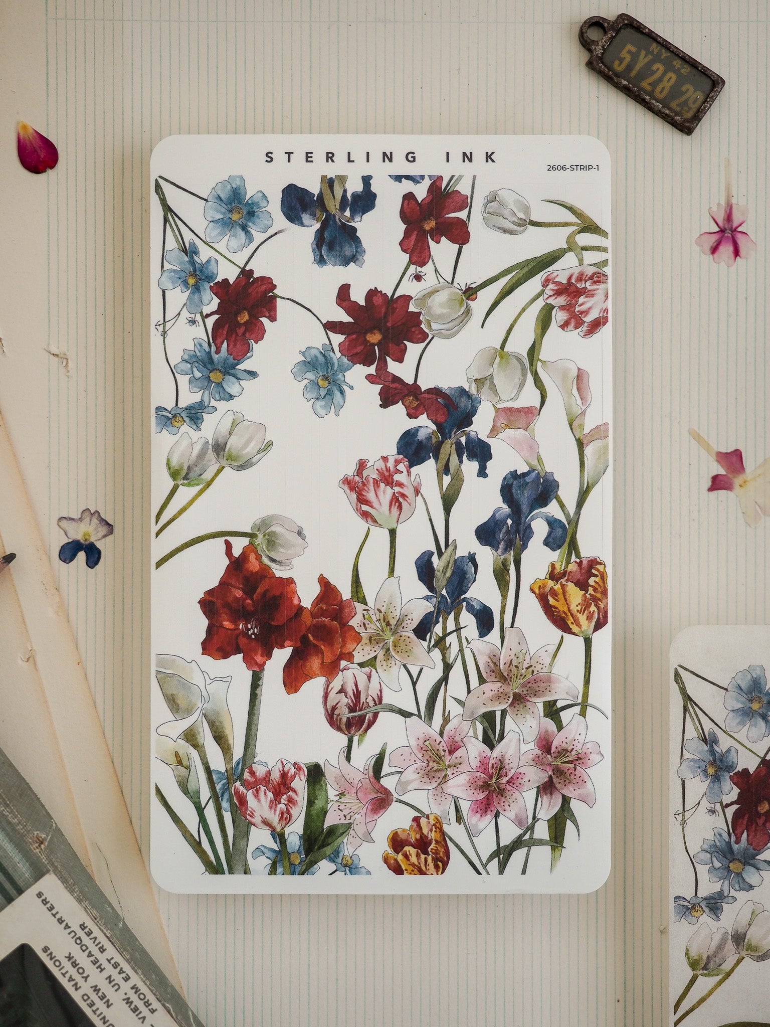 Vibrant botanical watercolor pattern featuring a dense bouquet of deep red, blue, and pink flowers, suitable for crafting, stickers, or journaling.