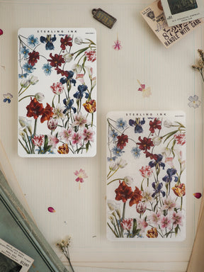Set of two watercolor floral stickers featuring rich blooms of red, blue, and pink wildflowers, designed for journaling, scrapbooking, or crafting projects.