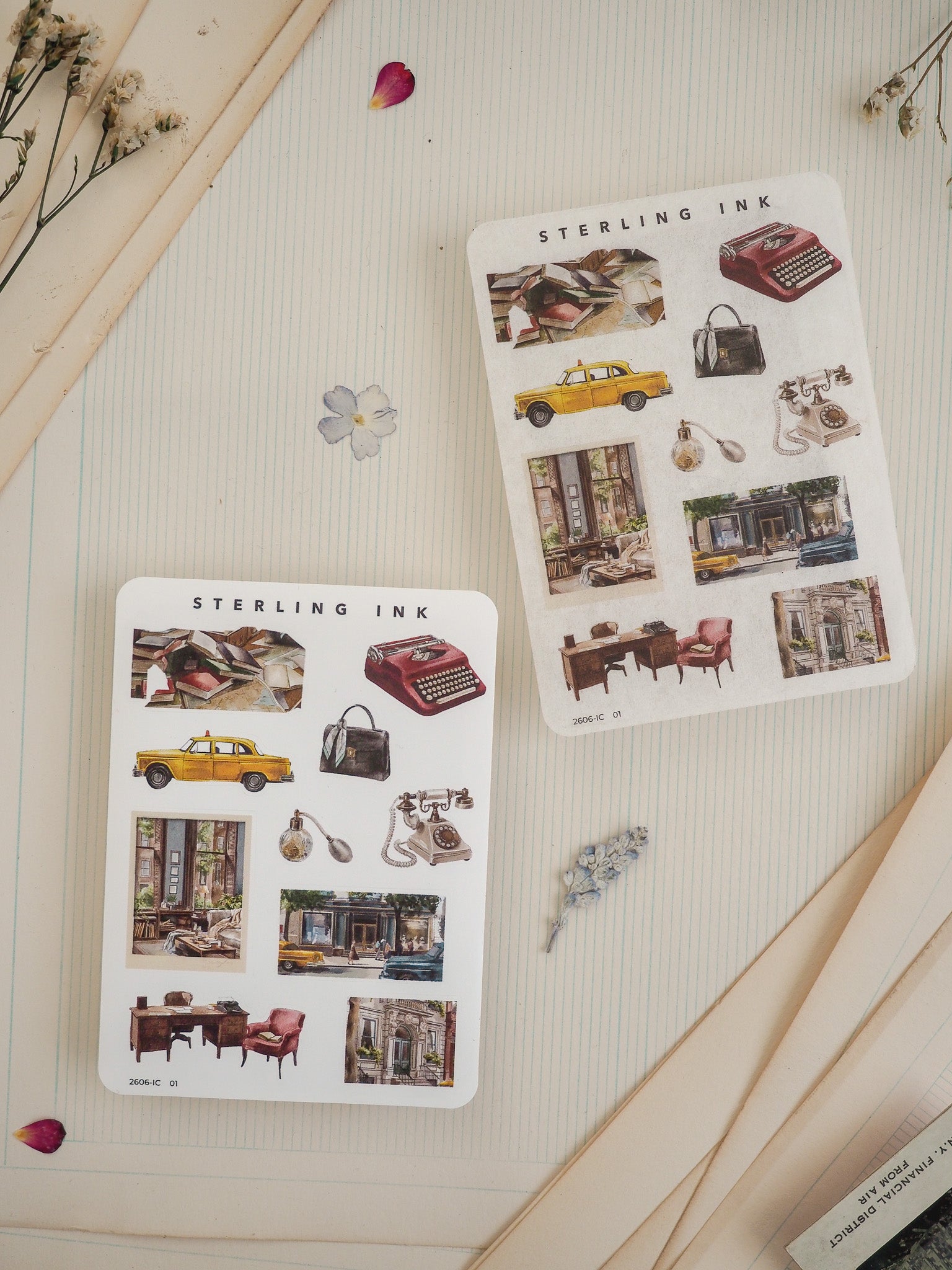 Set of "Sterling Ink" sticker sheets with vintage illustrations of retro items, including classic yellow cars, typewriters, and nostalgic architectural scenes.
