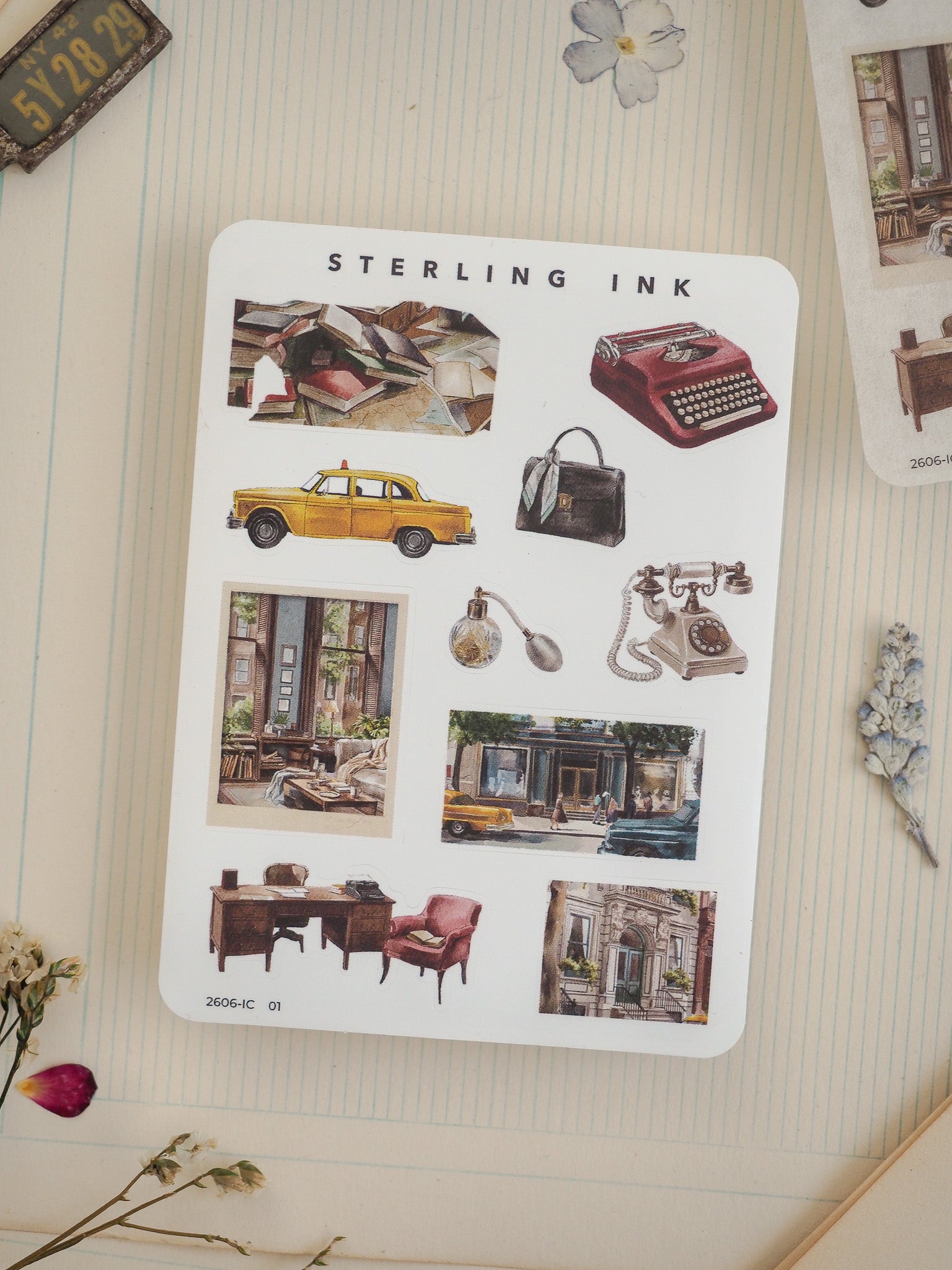 Retro vintage sticker sheet from Sterling Ink featuring an assortment of illustrated objects, including a yellow cab, rotary phone, briefcase, and historic city scenes.