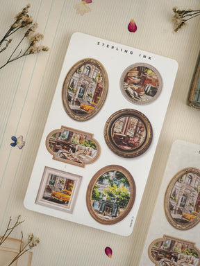 A set of vintage "Sterling Ink" stickers featuring multiple distressed circular photo designs depicting nostalgic European streetscapes and interior scenes.