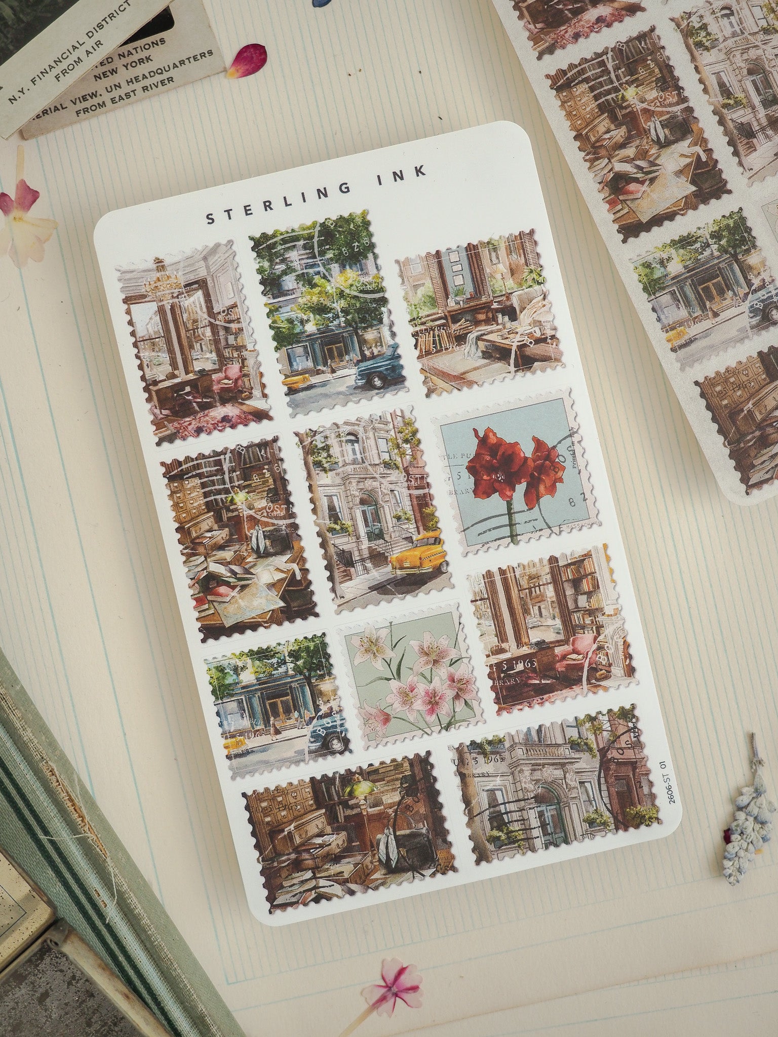 Sterling Ink sticker sheet featuring a grid of vintage postcards depicting detailed, charming scenes of historic city streets, old architecture, and classic urban life.
