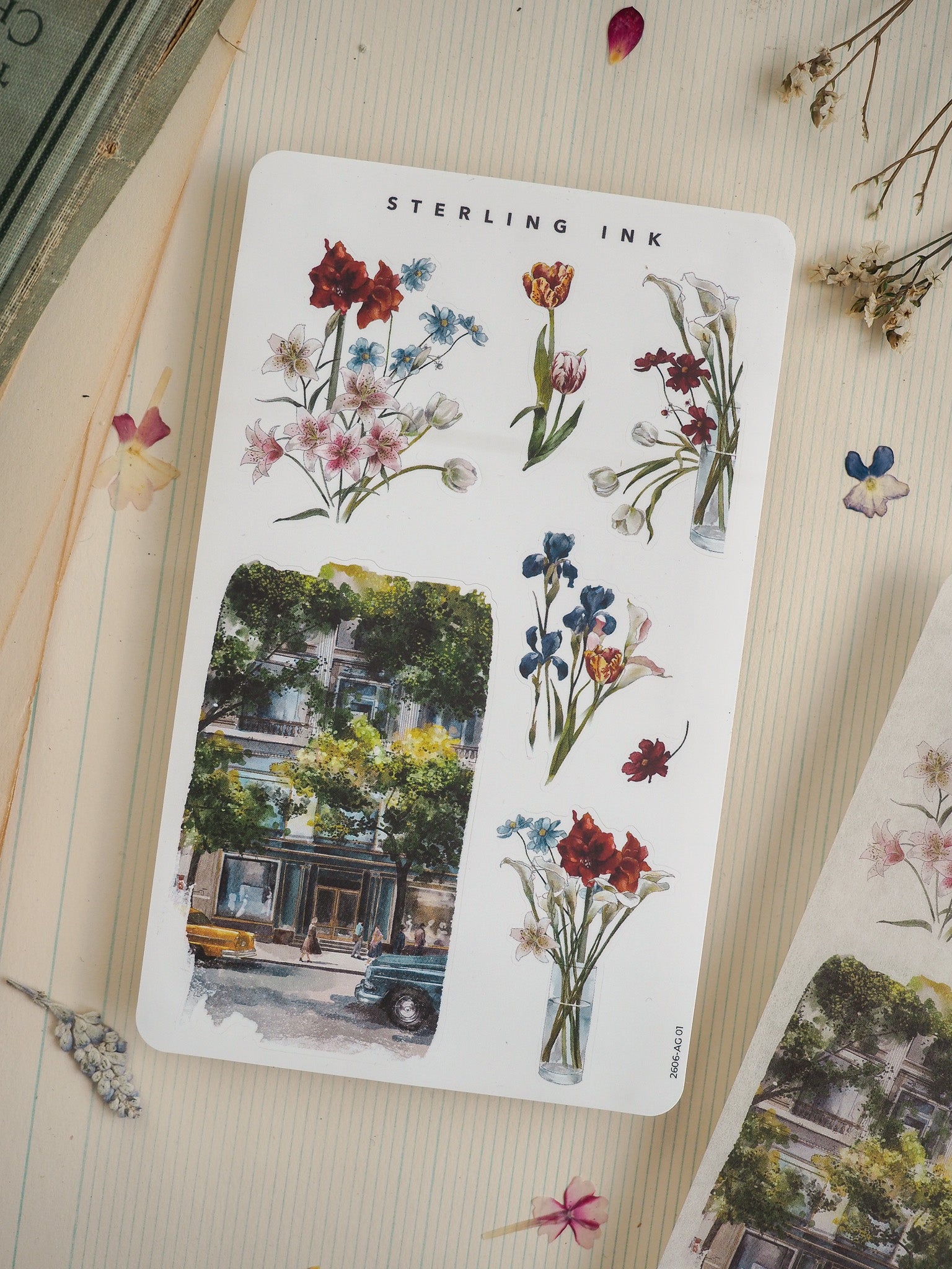 Botanical watercolor art sheet from Sterling Ink, featuring elegant bouquets of colorful flowers and a complementary lush watercolor cityscape design.