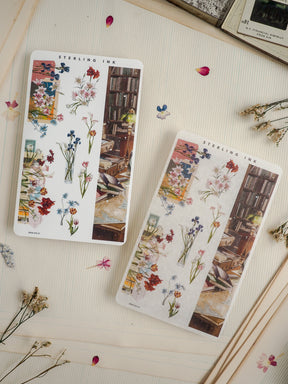 Two floral botanical sticker sheets featuring watercolor renderings of wildflowers and roses displayed in vases against a rustic backdrop of stacked books, labeled "STERLING INK."