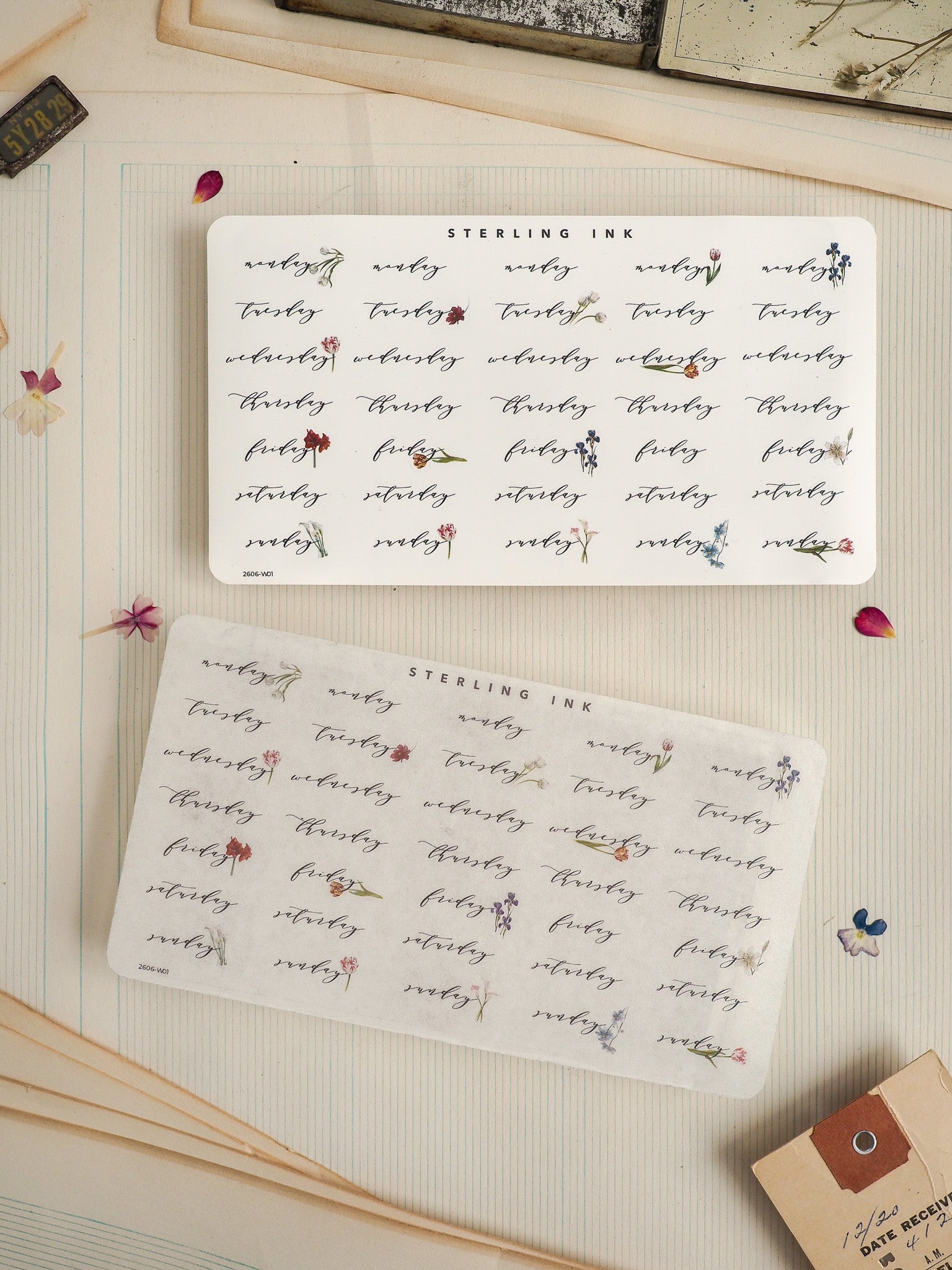 Decorative stationery featuring multiple white labels printed with "STERLING INK" and intricate sepia-toned botanical motifs, perfect for journaling or crafting.