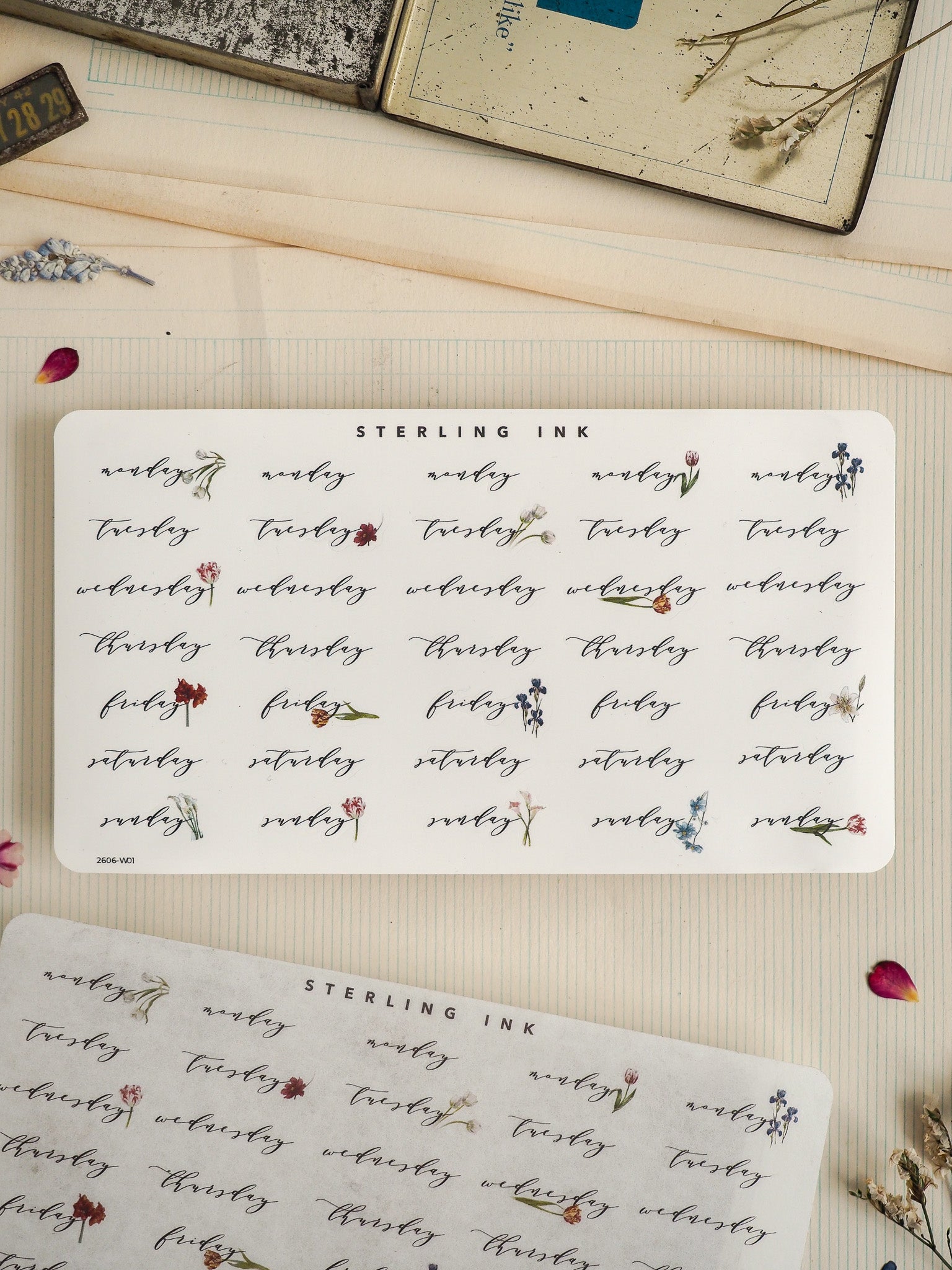 Decorative "STERLING INK" sticker sheet featuring repeating rows of delicate, hand-drawn botanical motifs in black ink, ideal for journaling and crafting.
