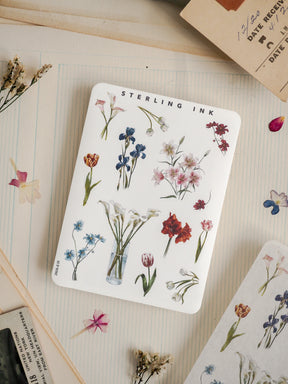 Watercolor botanical sticker featuring "Sterling Ink" and detailed clusters of blue, pink, and red wildflowers, perfect for crafting.