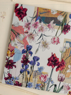 Lush watercolor floral pattern featuring a dense botanical arrangement of white, pink, and deep red lilies, orchids, and varied blossoms.