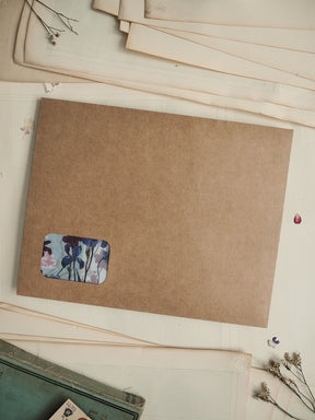 Kraft brown card stationery featuring a delicate watercolor sticker design of blue and purple flowers.