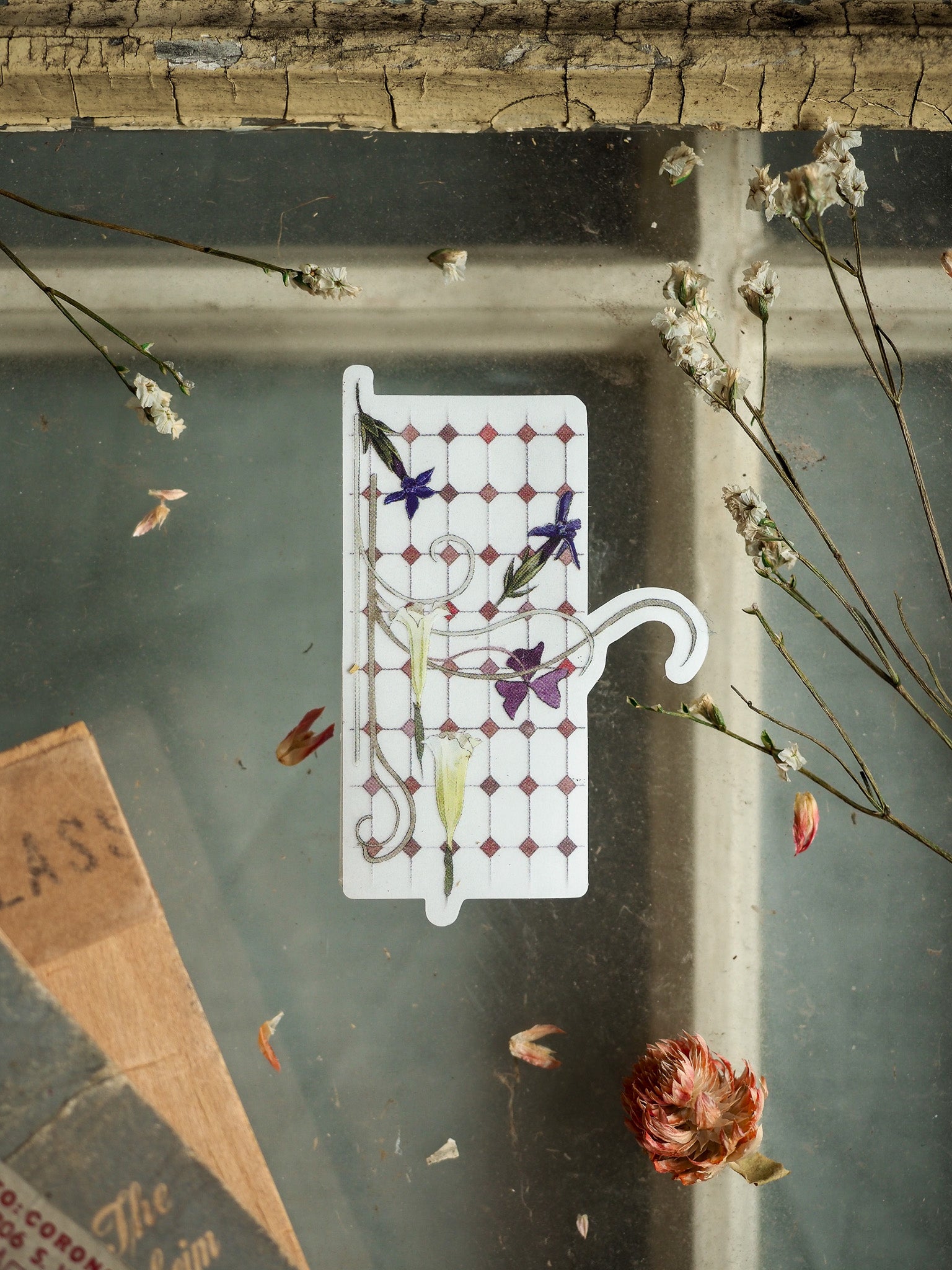 Clear vinyl sticker featuring a delicate dotted grid background, adorned with purple and blue wildflowers and elegant green stems.