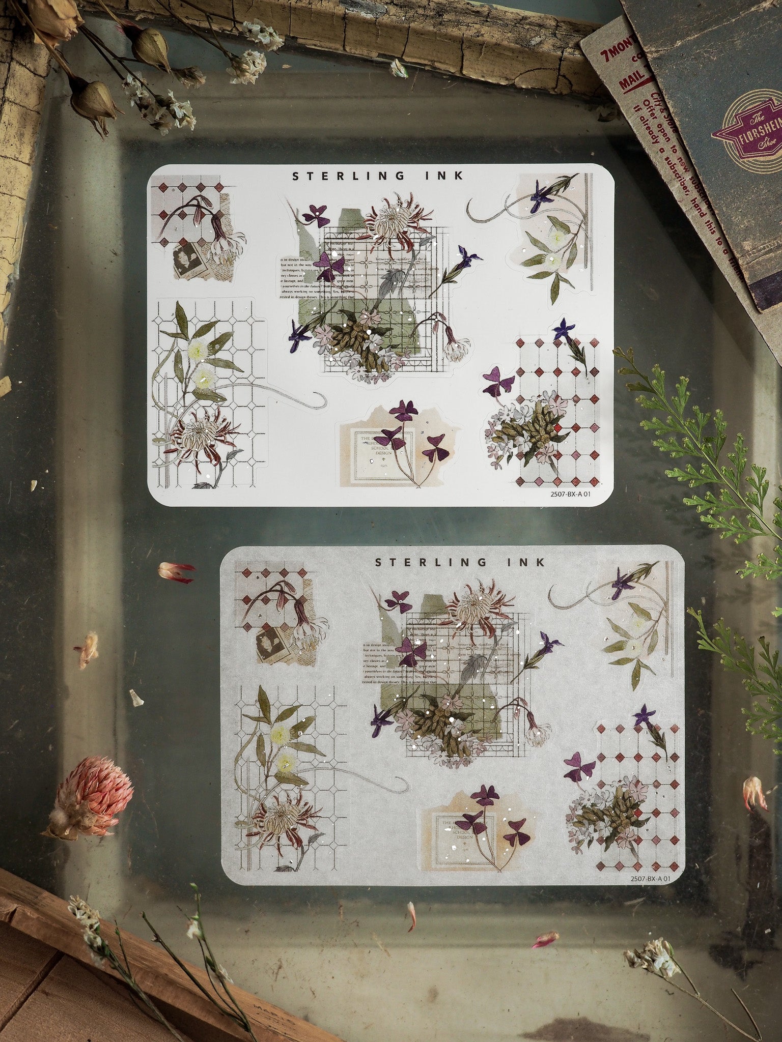 Decorative silver foil stickers featuring intricate botanical corners and delicate watercolor-style florals for scrapbooking.