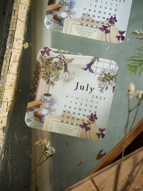 Elegant July 2025 floral calendar design featuring soft watercolor wildflowers and pastel botanical illustrations surrounding the date grid.