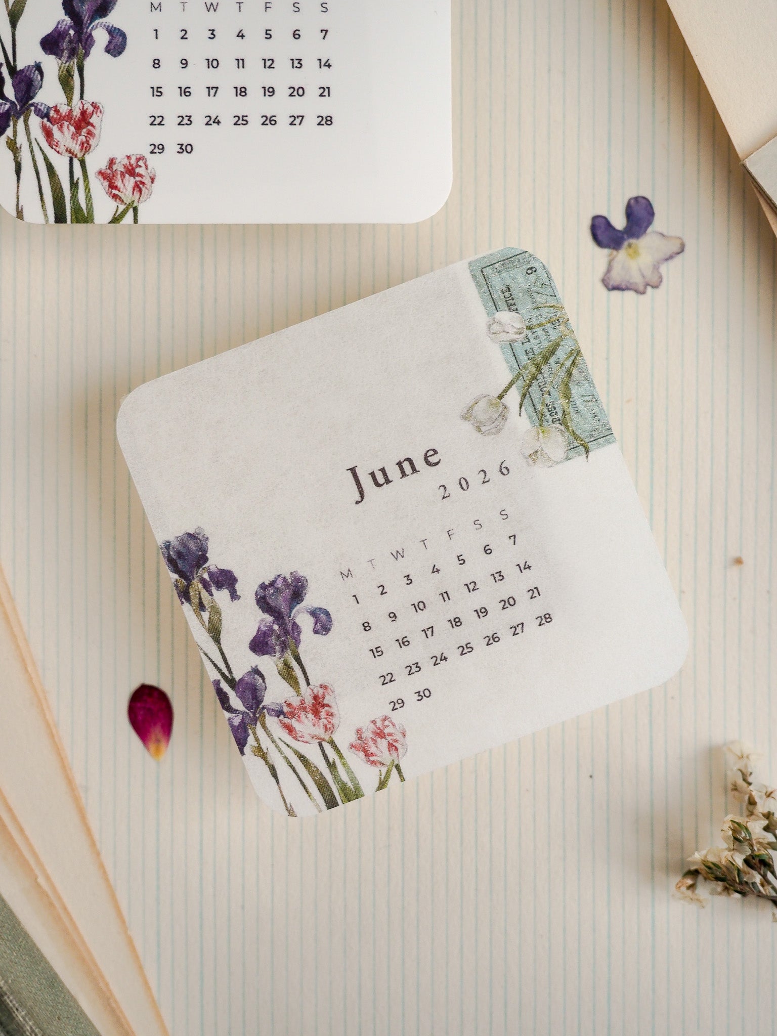 Botanical June 2026 planner stickers featuring delicate watercolor purple and blue florals, ideal for journaling and decorative scrapbooking organization.