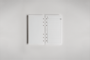 Structured white daily planner inserts featuring a perforated grid layout, ideal for organizing 2026 appointments and detailed schedules.