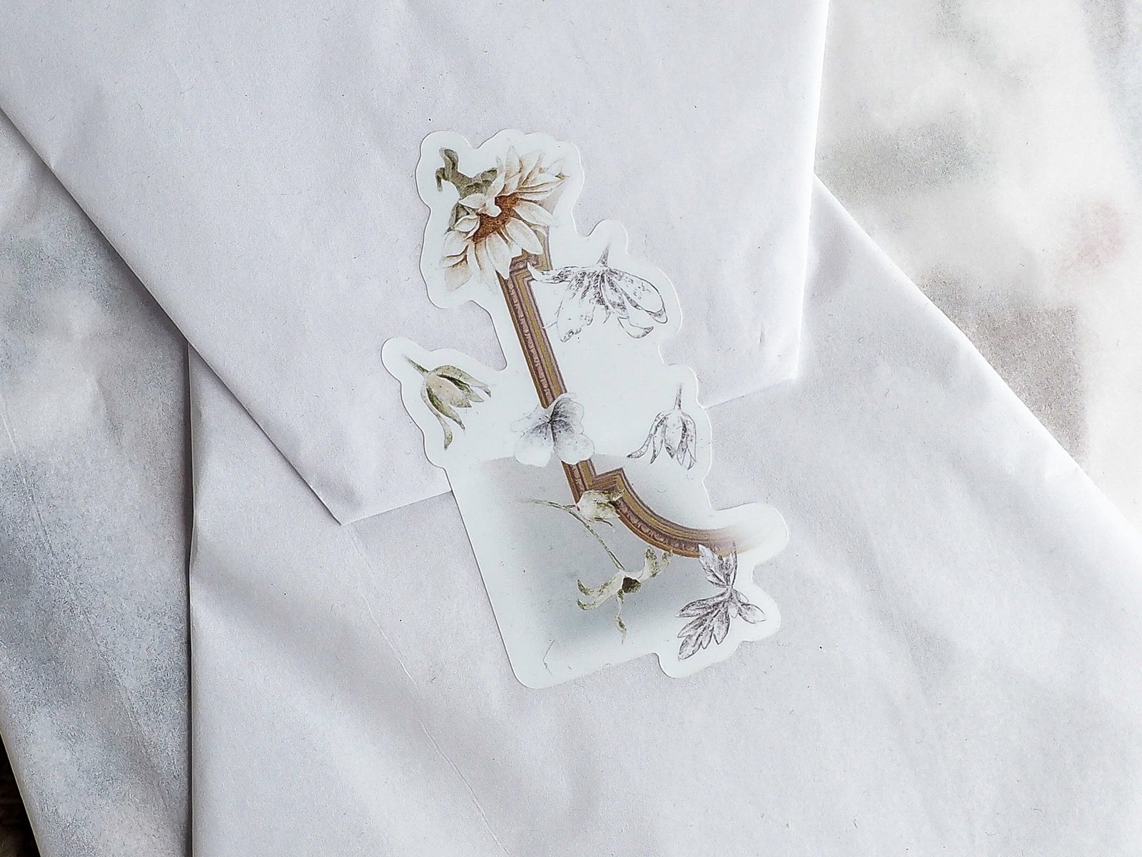 Botanical die-cut sticker featuring an autumnal arrangement of dried flora, sepia-toned flowers, and natural botanical elements, themed for August 2023.