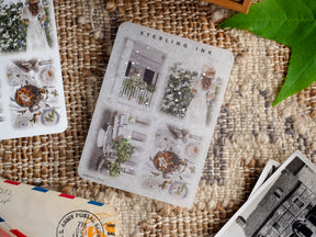 Vintage monochromatic sticker sheet featuring detailed illustrations of gardens, pottery, and a small tortoise under the "STERLING INK" title.
