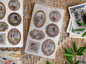 Decorative sticker sheet featuring vintage, sepia-toned architectural scenes encapsulated in ornate picture frames perfect for scrapbooking and journaling.