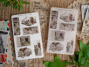 Vintage scrapbook stickers featuring sepia-toned ephemera, architectural drawings of storefronts, and rustic floral elements for journaling and crafting.