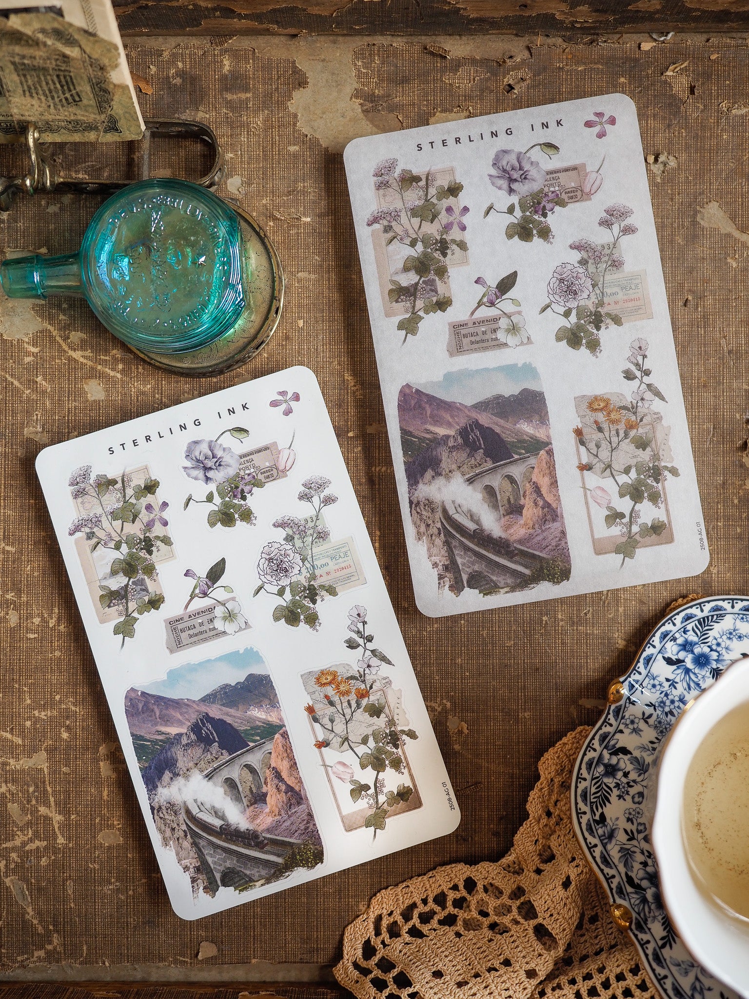Vintage botanical and travel arrangement stickers featuring detailed illustrations of wildflowers, roses, and sepia-toned images of stone arches.