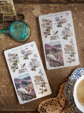 Vintage botanical and travel arrangement stickers featuring detailed illustrations of wildflowers, roses, and sepia-toned images of stone arches.