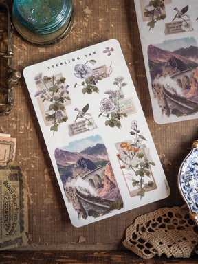 Elegant vintage sticker collection featuring delicate botanical bouquets, archival dates, and a dramatic sepia-toned mountain arch bridge scene.