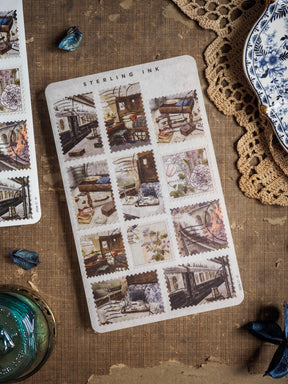 Vintage "Sterling Ink" stamp stickers for August 2025, featuring a grid of distressed, antique illustrations depicting detailed scenes of old city buildings and storefronts.