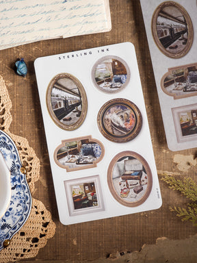 Sterling Ink sticker sheet featuring vintage, ornate photo frame borders with nostalgic images of trains, homes, and rustic scenes.
