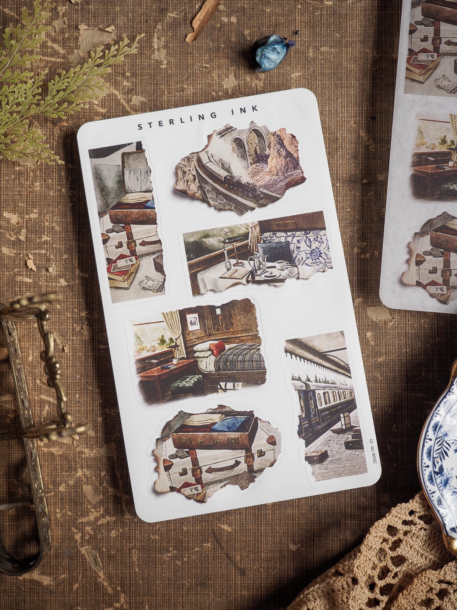 Sheet of distressed, sepia-toned stickers with ripped edges, displaying vintage photographs of antique furniture and historic rooms.