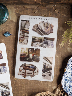 Sheet of vintage, sepia-toned stickers with torn paper edges, showcasing rustic vignettes of historical interiors and antique furniture designs.